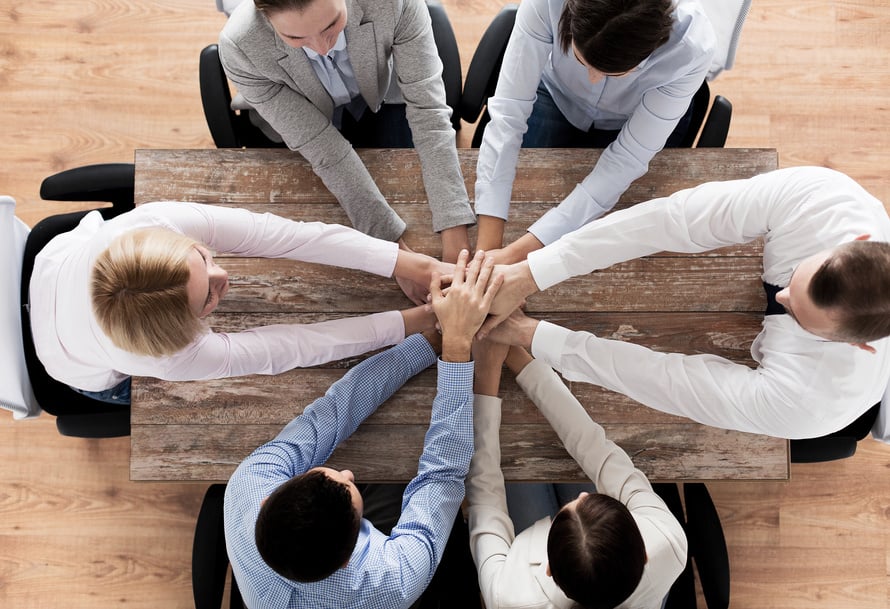 Close up of Business Team with Hands on Top